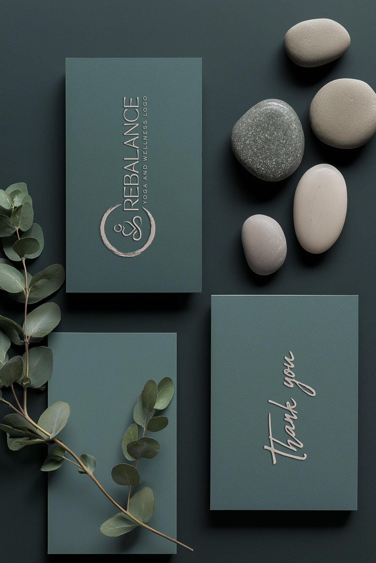wellness logo design for yoga studio shown on a dark teal business card and stationery