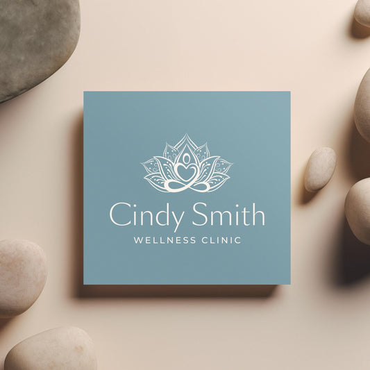 Image of a sophisticated wellness clinic logo featuring an elegant lotus design in gold on a deep teal blue background, perfect for high-end health, spa, and holistic therapy branding.